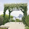 Big Chuppah 3m x 3m, greenery covered poles and top beam with White dendromium Big Chuppah 3m x 3m, greenery covered poles and top beam with White dendromium